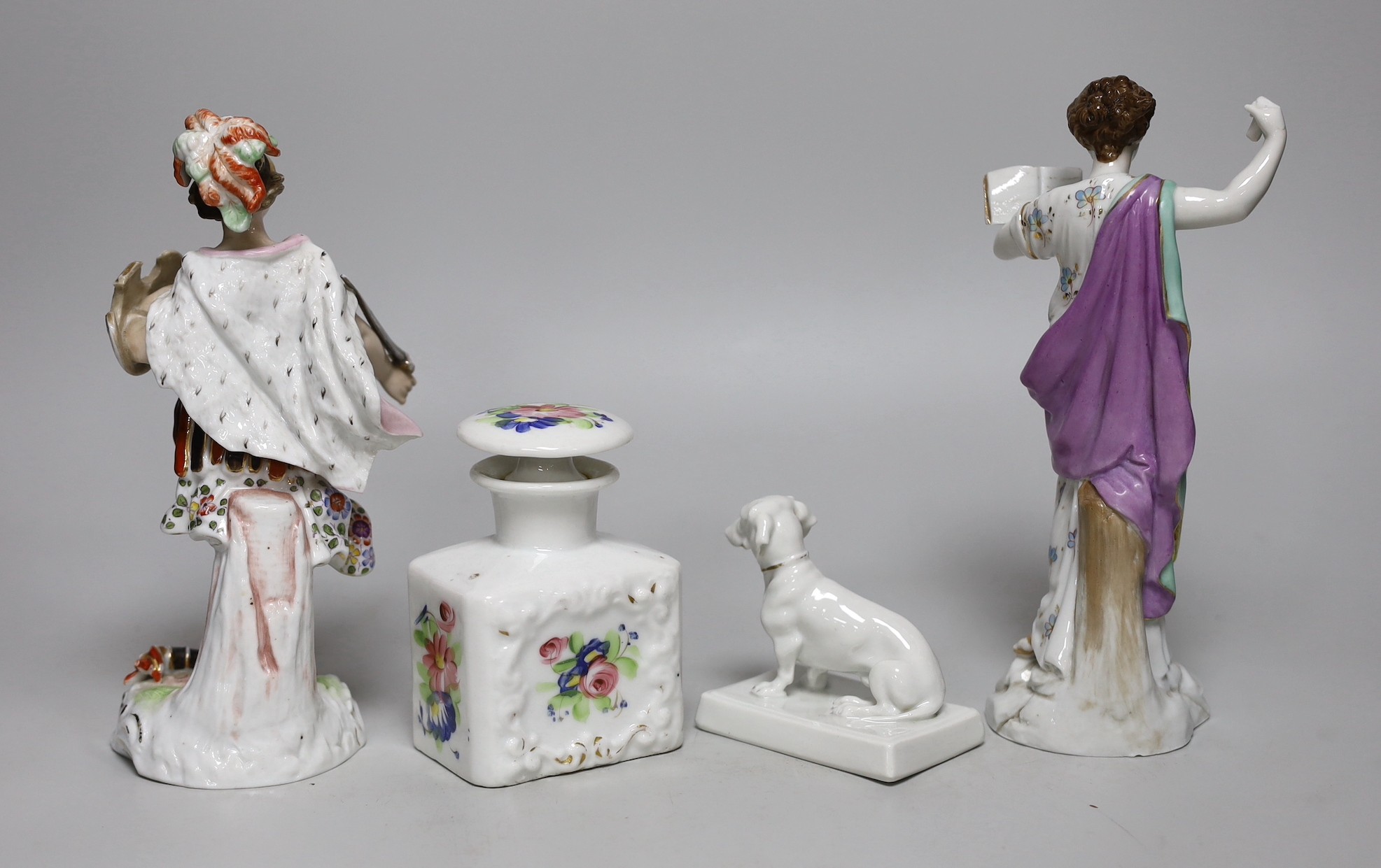 Two German porcelain figures, tallest 31cms high, a Fraureuth model of a dachshund and a Paris scent bottle
